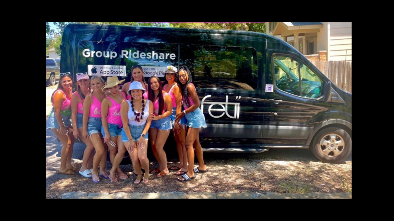 Bachelorette squad posing in front of Fetii van